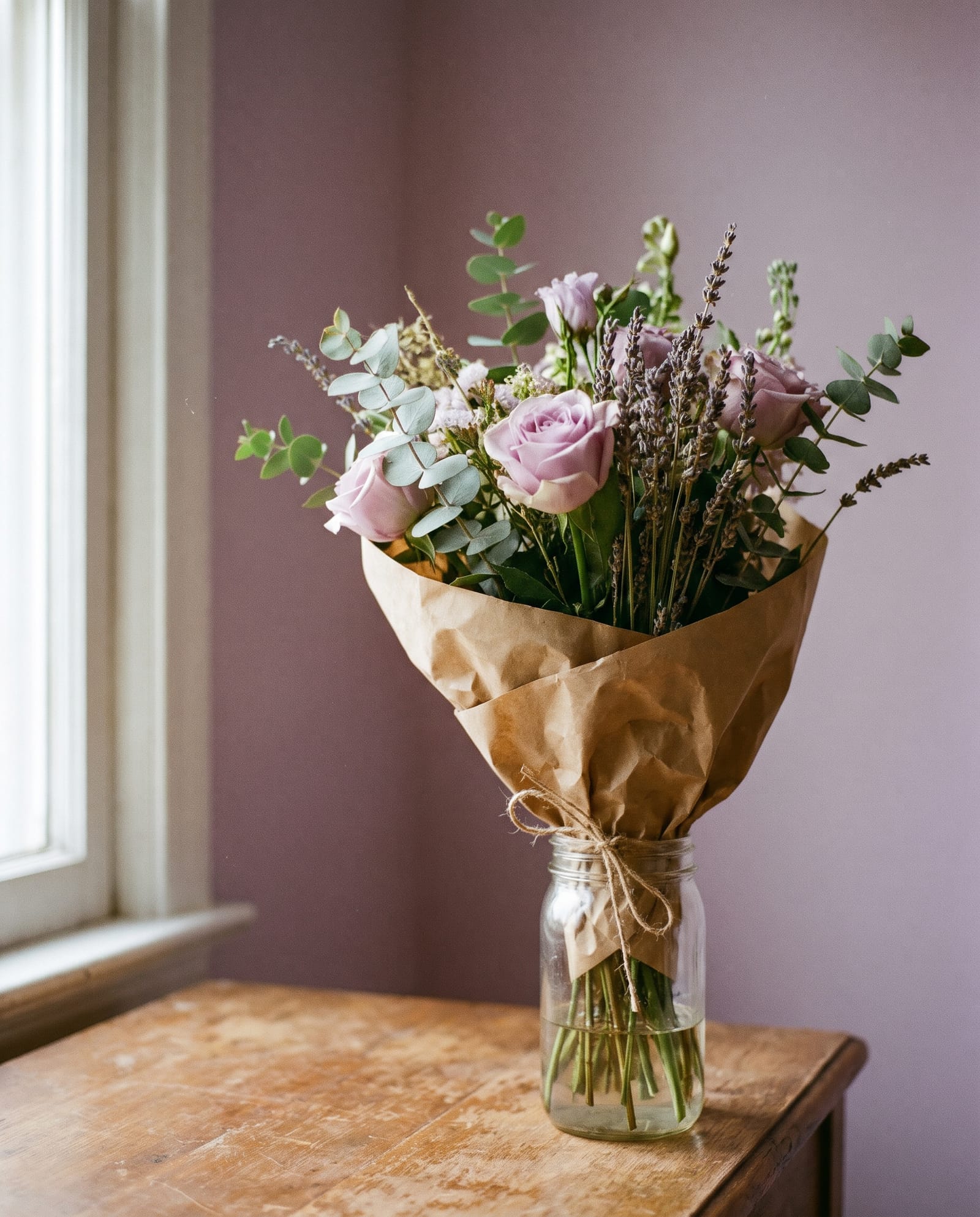 A hand-tied bunch of flowers wrapped in paper
